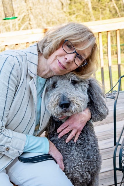 Carol hugging dog